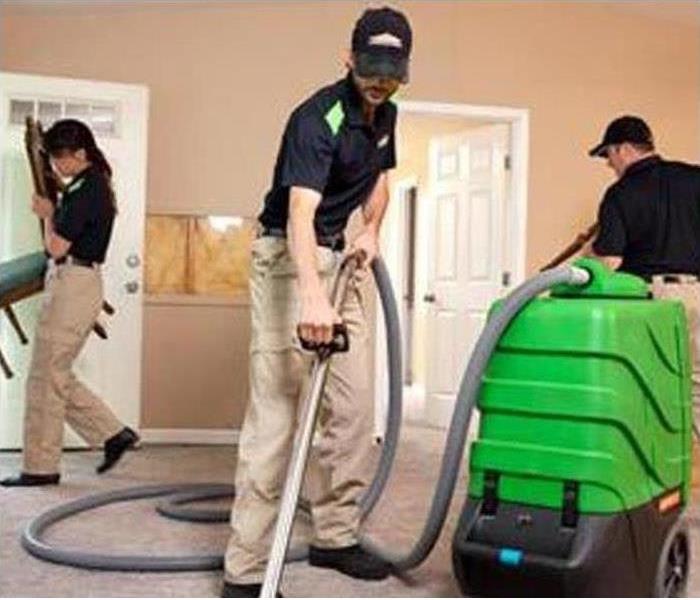 SERVPRO staff doing the cleaning work
